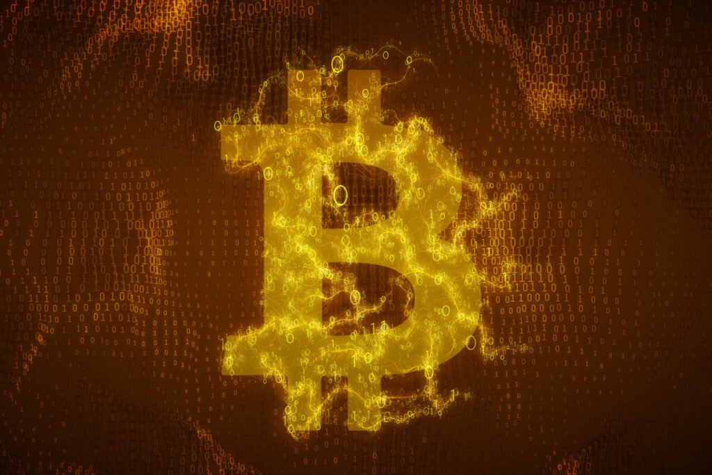 Monitor financiero mostrando pantallas de cotizaciones en rojo y gráficos descendentes que ilustran el invierno de las criptomonedas.
