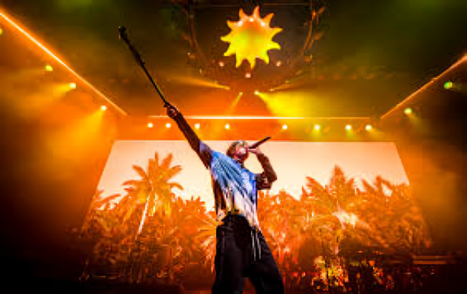 Danny Ocean en el escenario del Movistar Arena de Madrid, con una bandera de Venezuela de fondo y el público encendiendo luces.