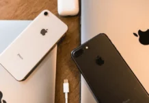 El análisis de la seguridad en la arquitectura de silicio de Apple y la deconstrucción de la vulnerabilidad usbliter8 Múltiples dispositivos iPhone antiguos organizados sobre una superficie plana de prueba, ilustrando los modelos afectados por la vulnerabilidad del BootROM de iPhone.