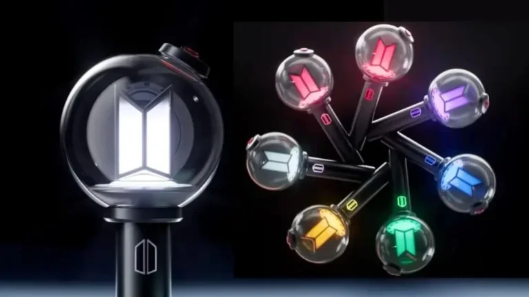 Lightstick Army Bomb de BTS iluminado en color morado durante concierto en estadio